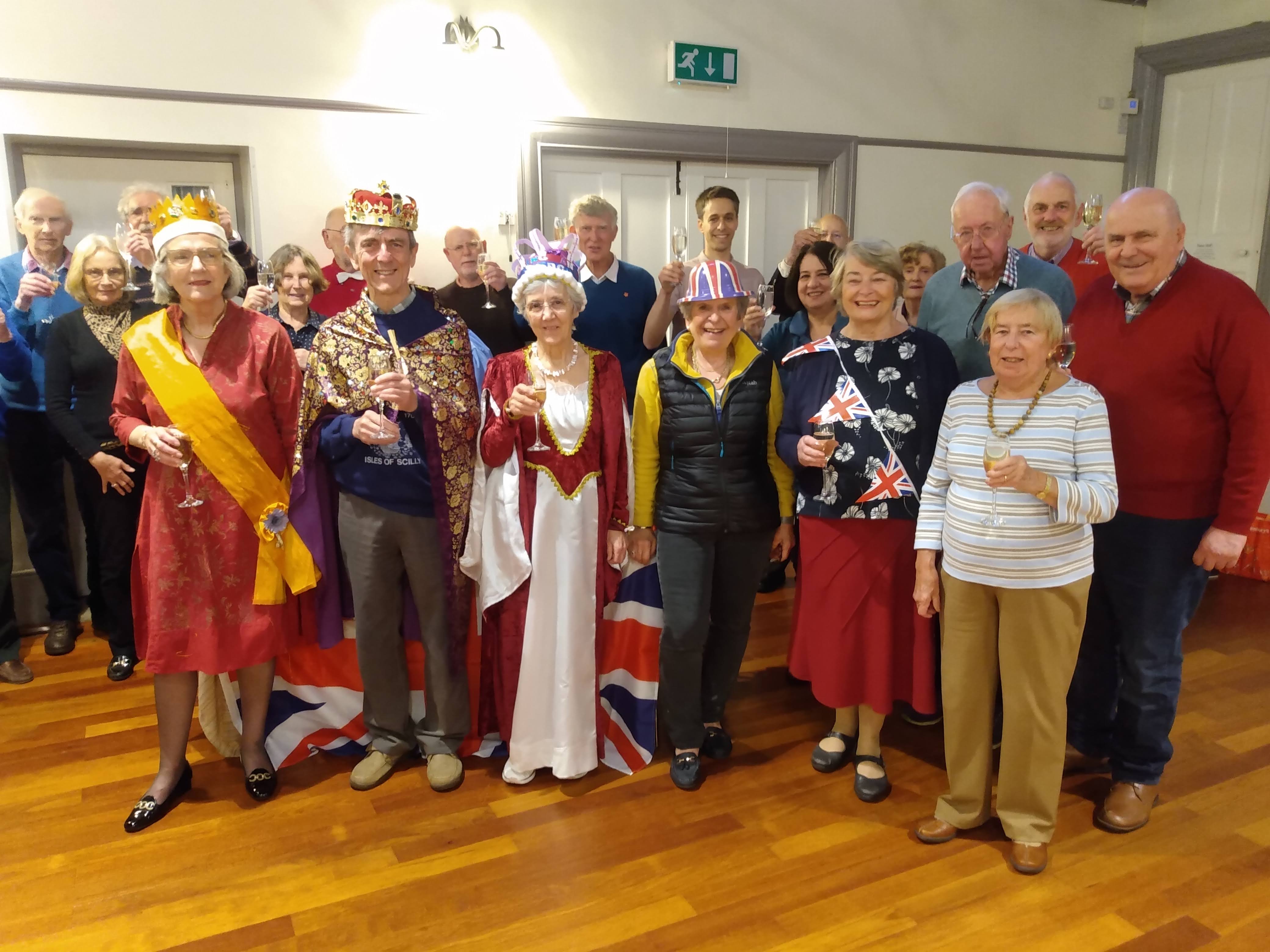 Goring & Streatley Bridge Club coronation party. Many of the members are dressed in fancy dress with hats and flags
